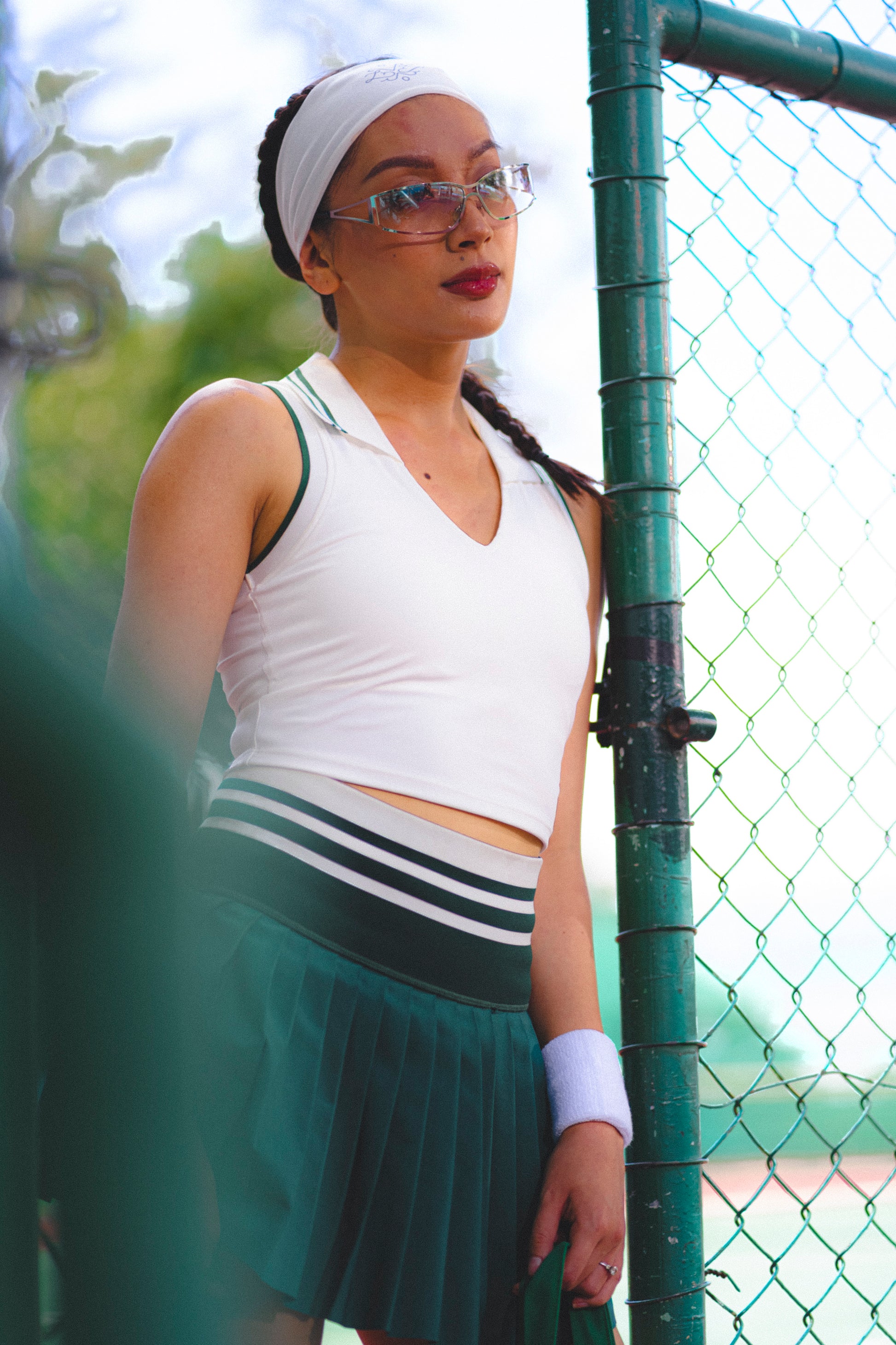 White sleeveless tennis polo with court green collar trim - Vola Well Played Polo